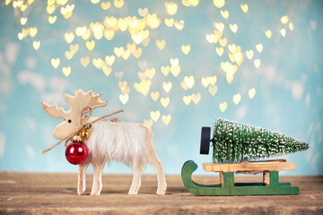 reindeer with sleigh and christmas tree