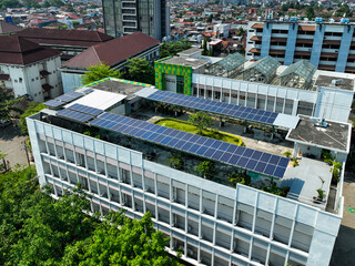 A large building with a green roof and solar panels