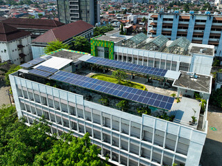 A large building with a green roof and solar panels