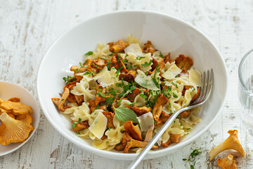 delicious farfalle pasta with chanterelle mushrooms and cheese