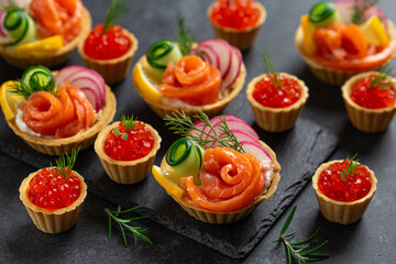 Mini tartlets with salmon red caviar and smoked salmon