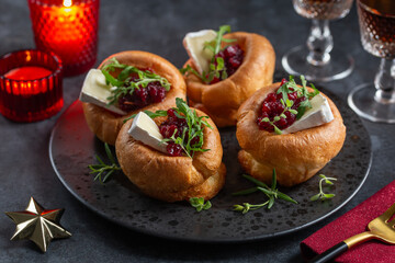 Traditional Yorkshire puddings with brie cheese and cranberry jam