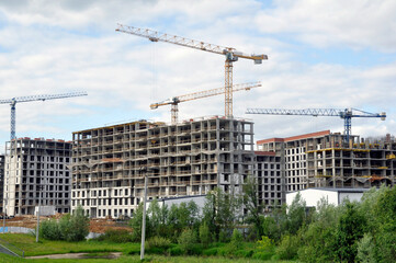 Fototapeta premium Construction of a new residential area. Construction equipment.
