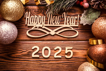 Happy new year 2025 on wooden brown background
