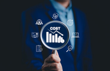 Cost reduction and financial efficiency concept. Businessman focusing on declining cost chart,...