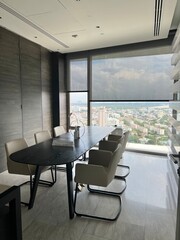 modern office interior with a long table and a city view