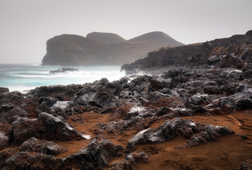 Rocky coast with lighthouse Farol da Ponta dos Capelinhos, Capelinhos peninsula, island of Faial, Azores, Portugal, Europe
