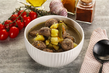 Soup with meatball and potato