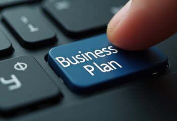 Finger Pressing "Business Plan" Key on Keyboard
