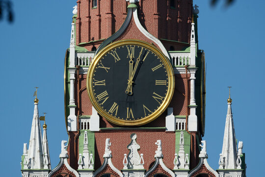 Clock on the Spasskaya tower of the Kremlin in Moscow, Russia. Spasskaya tower of the Moscow Kremlin on a sunny summer day