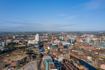 Fototapeta premium Aerial drone photo of the Leeds city centre showing the main city centre from above on a bright sunny summers day in the West Yorkshire city