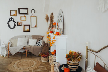 Cozy autumn decor in a bright living room with pumpkins and seasonal accents
