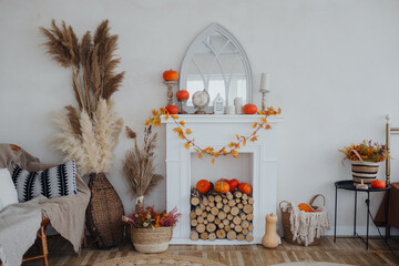 Cozy autumnal living room decor featuring a fireplace adorned with pumpkins and fall foliage