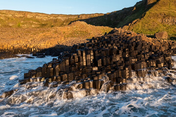 Close-up of the honeycomb rock formations at Giant's Causeway, showcasing iconic basalt stones in...