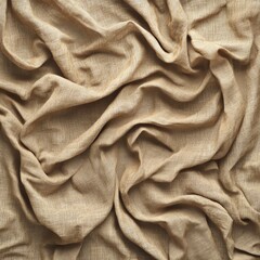 Fototapeta premium Close-up of crumpled beige fabric texture, creating a natural and organic pattern.