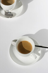 Cafe. Two Cups of Fresh Espresso Coffee Served on White Background. Drinking Coffee.