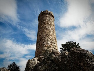 Ancient Stone Tower Against Blue Sky