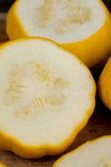 cut yellow ripe pumpkins on the table in close-up