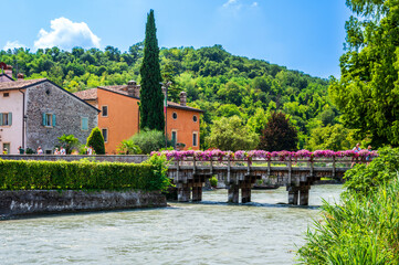 Fototapeta premium Summer on the Mincio river. Historic village of Borghetto sul Mincio