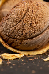 chocolate ice cream with chocolate chips on black slate