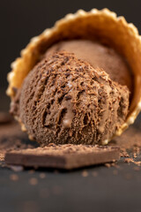 chocolate ice cream with chocolate chips on black slate