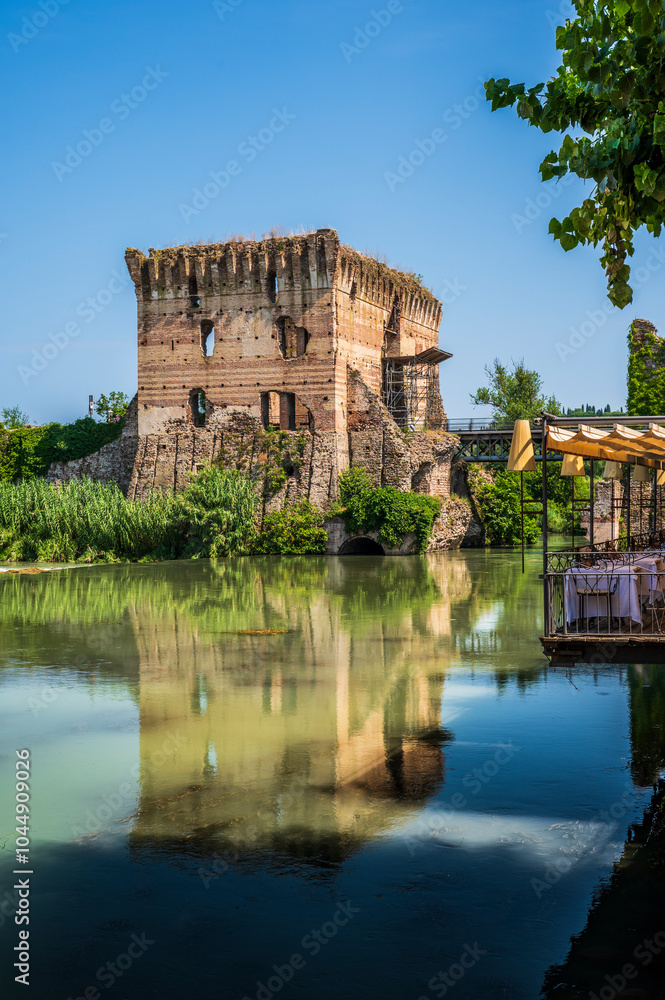 Wall mural Summer on the Mincio river. Historic village of Borghetto sul Mincio