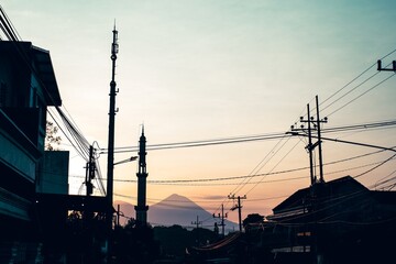 Silhouette of Mosque Minaret at Dawn in a Residential Area