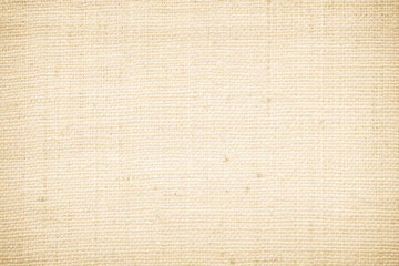 Closeup detail of beige fabric texture background. High resolution photo.