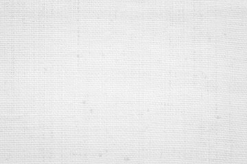 Fototapeta premium White textures of canvas, fabric, and paper showcasing a seamless design in natural shades of gray, ideal for a vintage backdrop or textile pattern.