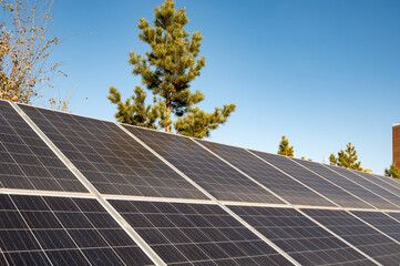 Close-up solar panels on a blue sky background on a sunny day