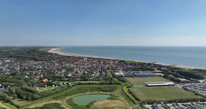Aerial footage of the Zoutelande cityscape on a clear sunny day in Veere city, Zeeland, Netherlands