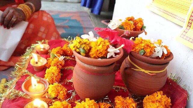 Traditional Karwa Chauth rituals, featuring Karwa Sthapana, diya lighting, and Chhat Pooja elements, symbolizing devotion, culture, and celebration of love and prosperity in Indian festivals