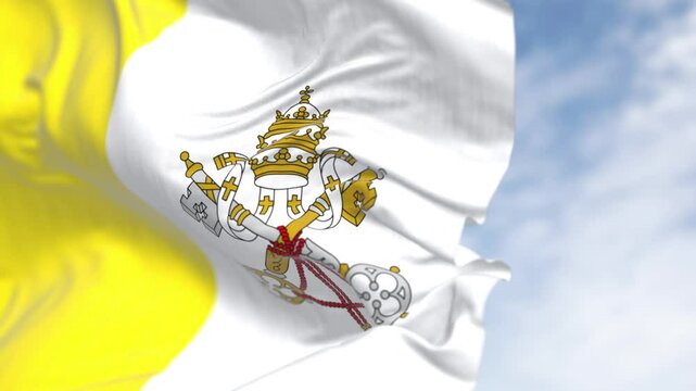 Flag of Vatican City waving in the wind on a clear day