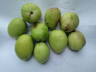 Organic raw tomatoes. Green unripe tomatoes.