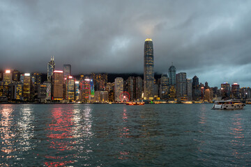 Hong Kong downtown skyline across Victoria harbor at night, Hong Kong, China.