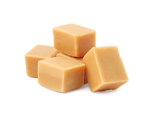 Tasty sweet caramel candies isolated on white