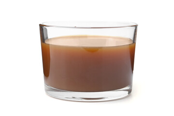 Tasty caramel sauce in glass bowl isolated on white