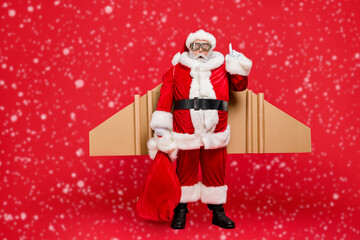 Full length photo of funny grey-hair snata think have creative spirit thoughts to deliver gifts on...