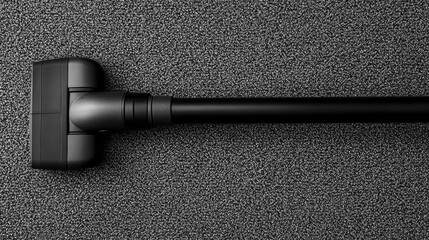Black Vacuum Cleaner Head on Dark Surface