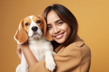 Thai woman hugging beagle pet portrait looking.