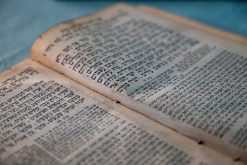 closeup of an old book written in hebrew - jewish religious background