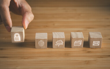 wooden cube block of cyber security icons on wooden table. cyber security, innovation technology,...