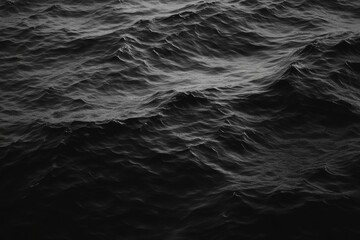 Dark and moody, the ocean waves roll in a deep, dramatic fashion.