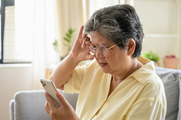 Senior people lifestyle health problem concept : Portrait photo of senior Asian woman has an eye...