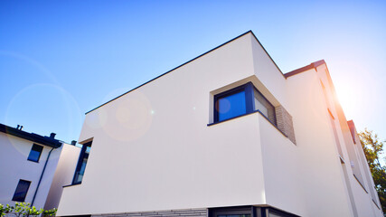 Residential homes with modern facade.Terraced family homes in newly developed housing estate. The real estate market in the suburbs. New single family houses in a new development area. 