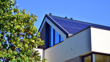 Harmony with nature, eco architecture. Terraced single family homes in newly developed housing estate. The real estate market in the suburbs with lush greenery surrounding. 