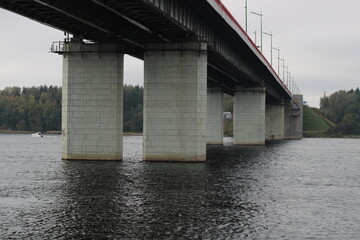The river and the bridge supports are close