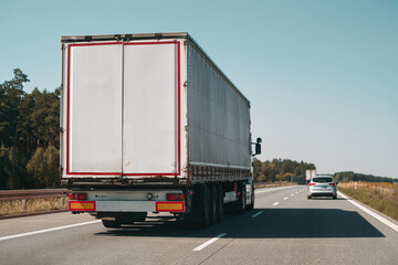 Large truck driving on highway road.