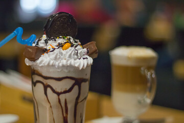 Sweet dessert with cookies in glass