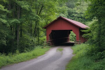 Fototapeta premium Scenic View of a Red Covered Bridge in Lush Greenery